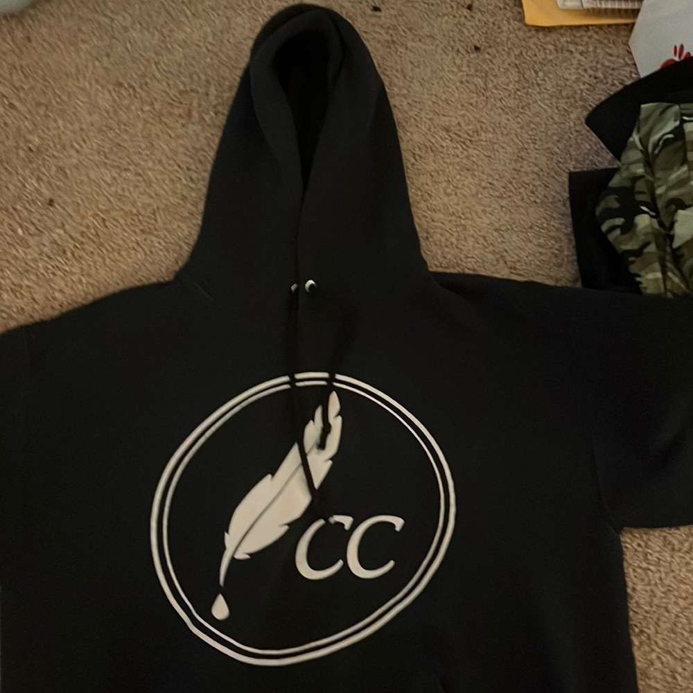 Black hoodie says Cc on the front and press on the back!! Comfy and warm